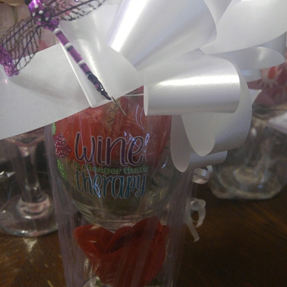 Cup with candies and a lip gloss.